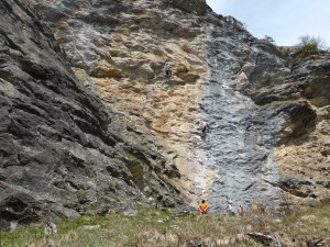 A few rock climbers on the cliff left of the path