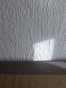 Light on the wall and bed