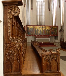 Fribourg, Cordeliers convent: elaborately carved pews and c.14th altar piece