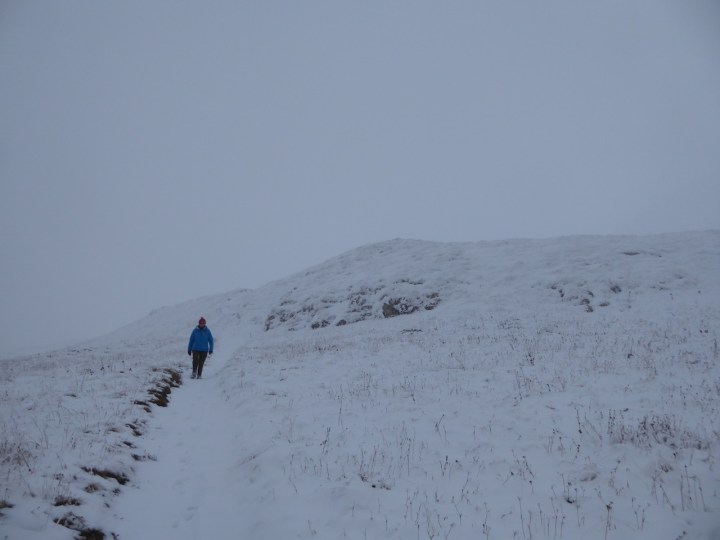 Making our way back down Solaise in the clouds