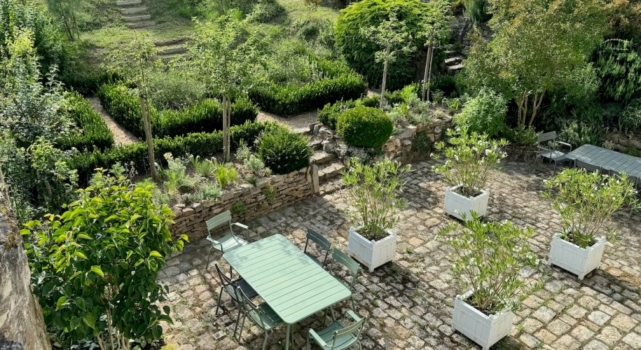 Resilient 'White Garden' blending stylish Sissinghurst formality with resilient plants able to withstand drought and extreme conditions.