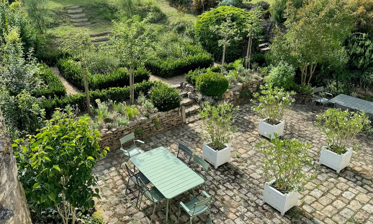 Resilient 'White Garden' blending stylish Sissinghurst formality with resilient plants able to withstand drought and extreme conditions.