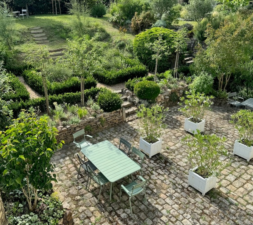 Resilient 'White Garden' blending stylish Sissinghurst formality with resilient plants able to withstand drought and extreme conditions.