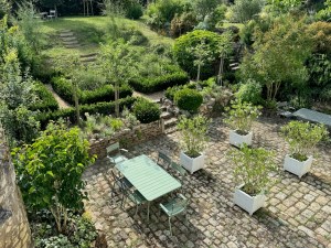 Resilient 'White Garden' blending stylish Sissinghurst formality with resilient plants able to withstand drought and extreme conditions.
